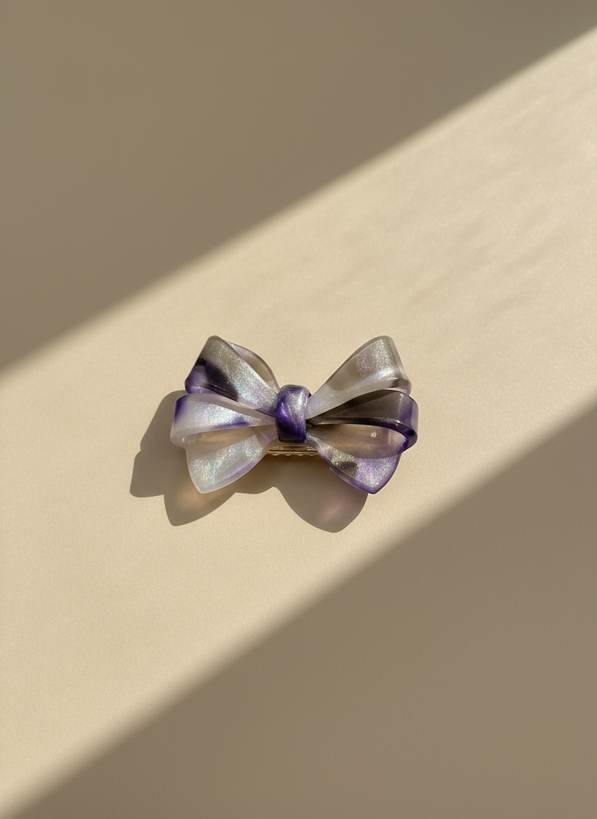 Blush, purple and smoky ombré aztec bow hair clipBow-shaped hair accessory with purple and gold colors on a light gray background. only at Petite Murmure