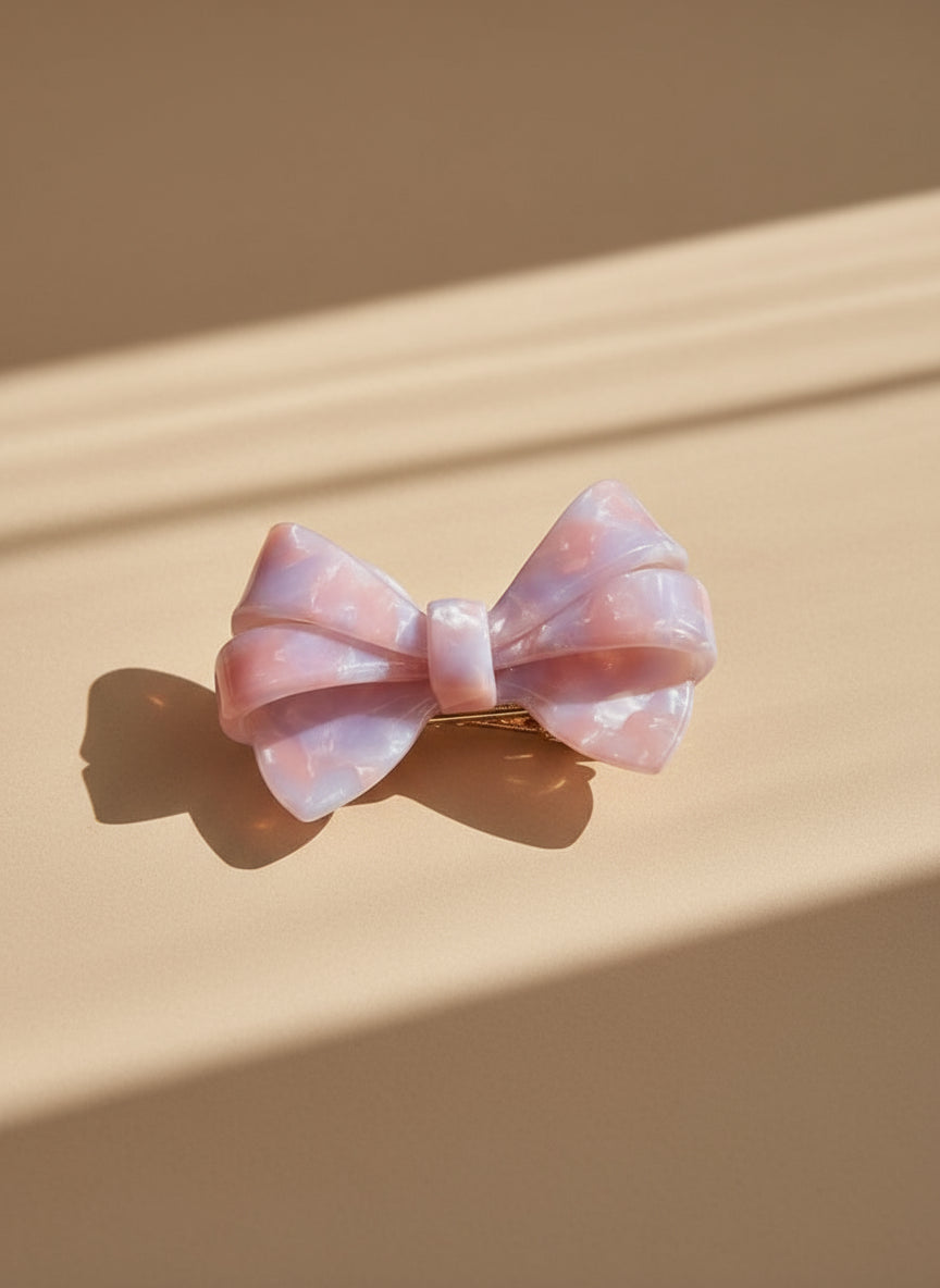 Pink and lilac Blush ombré aztec bow hair clip bow hair clip on a beige background