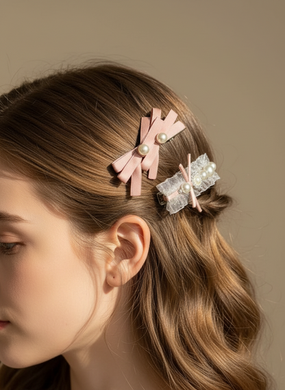 Model with hair styled with pink bow ,peals, and organza hair clips against a neutral background
