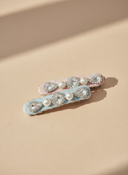Two  handmade decorative lace hair clip with pearls and Swarovski crystals on a soft neutral background. Only at Petite Murmure 