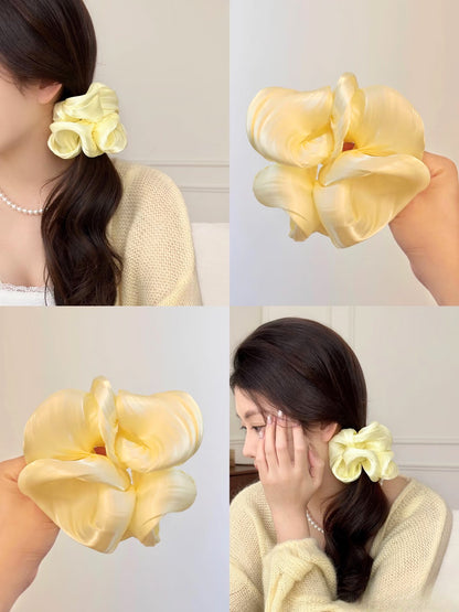 Collage of a yellow organza hair scrunchie being wore by a female with long dark waivy hair. only at petite murmure