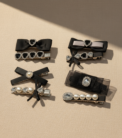 Set of decorative hair clips with Swarovski crystals , bows and pearls on a beige background