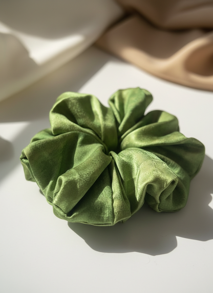 Green Handmade Green Tea Scented Mulberry Silk Scrunchies  on a light background