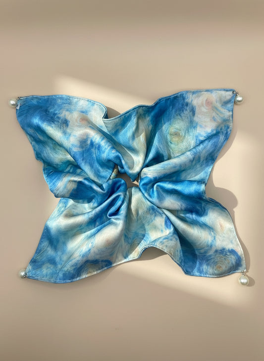 Blue and white tie-dye satin square handkerchief scrunchie with pearl detail  on a beige background, only at petitemurmure.com