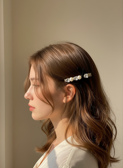 Woman with pearl and Swarovski hair clip on a neutral background